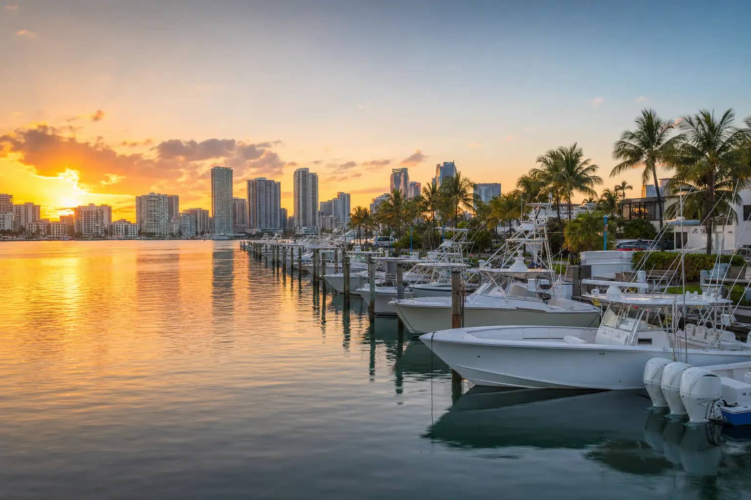Miami marina at sunrise with center console boats